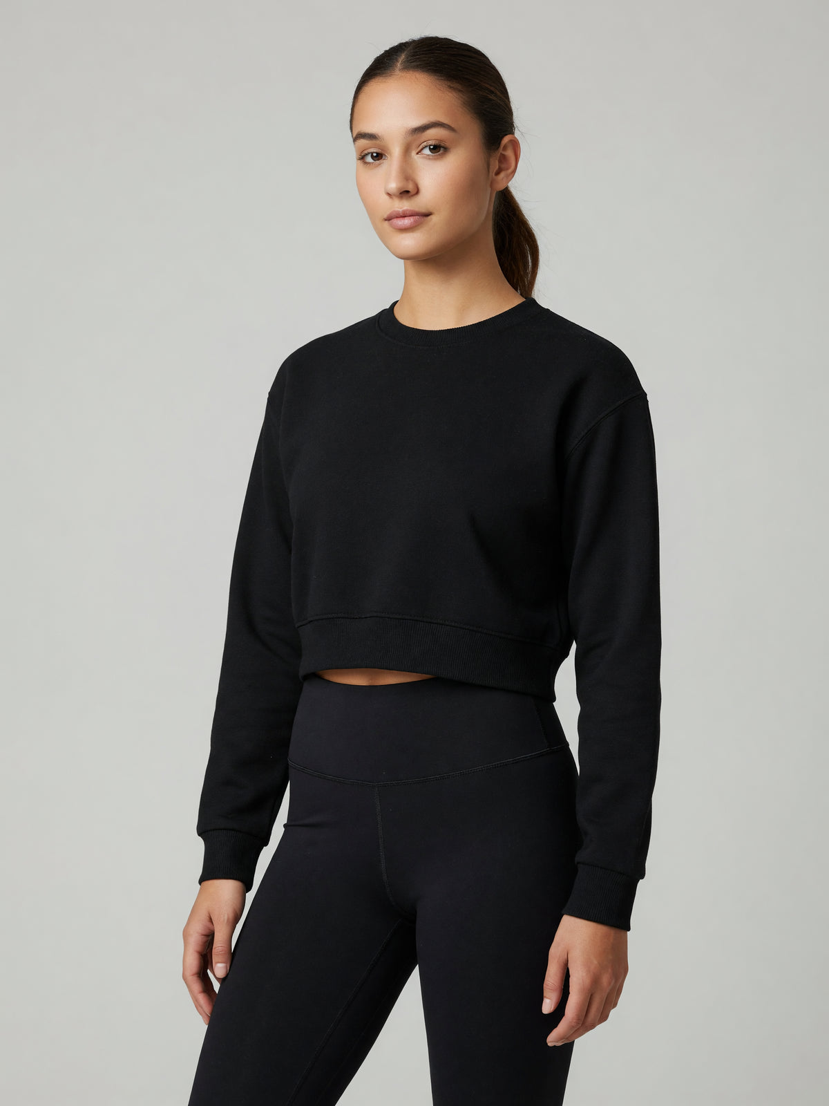 Cropped Crewneck Sweatshirt in Black, worn, three-quarter