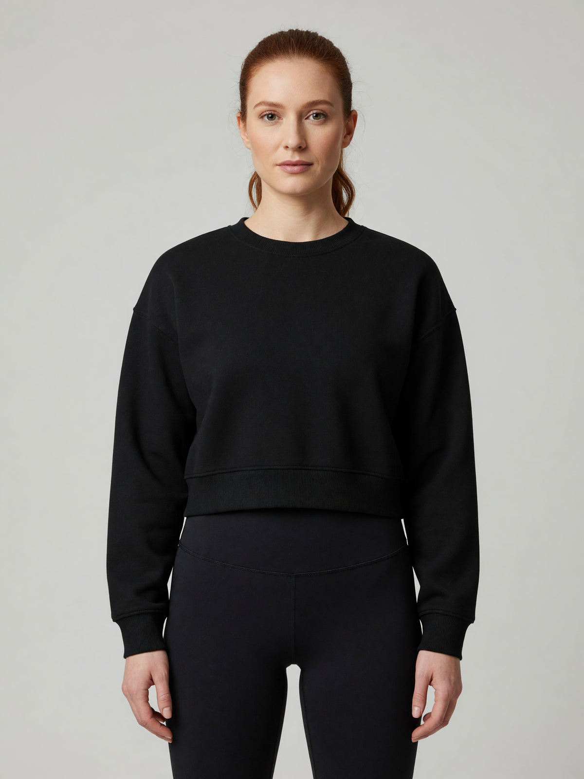 Cropped Crewneck Sweatshirt in Black, worn, front