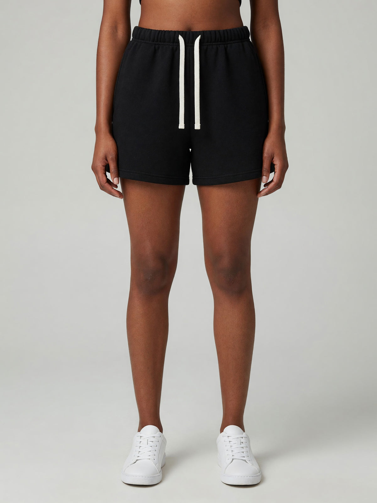 Drawstring Sweatshort in Black, worn, front