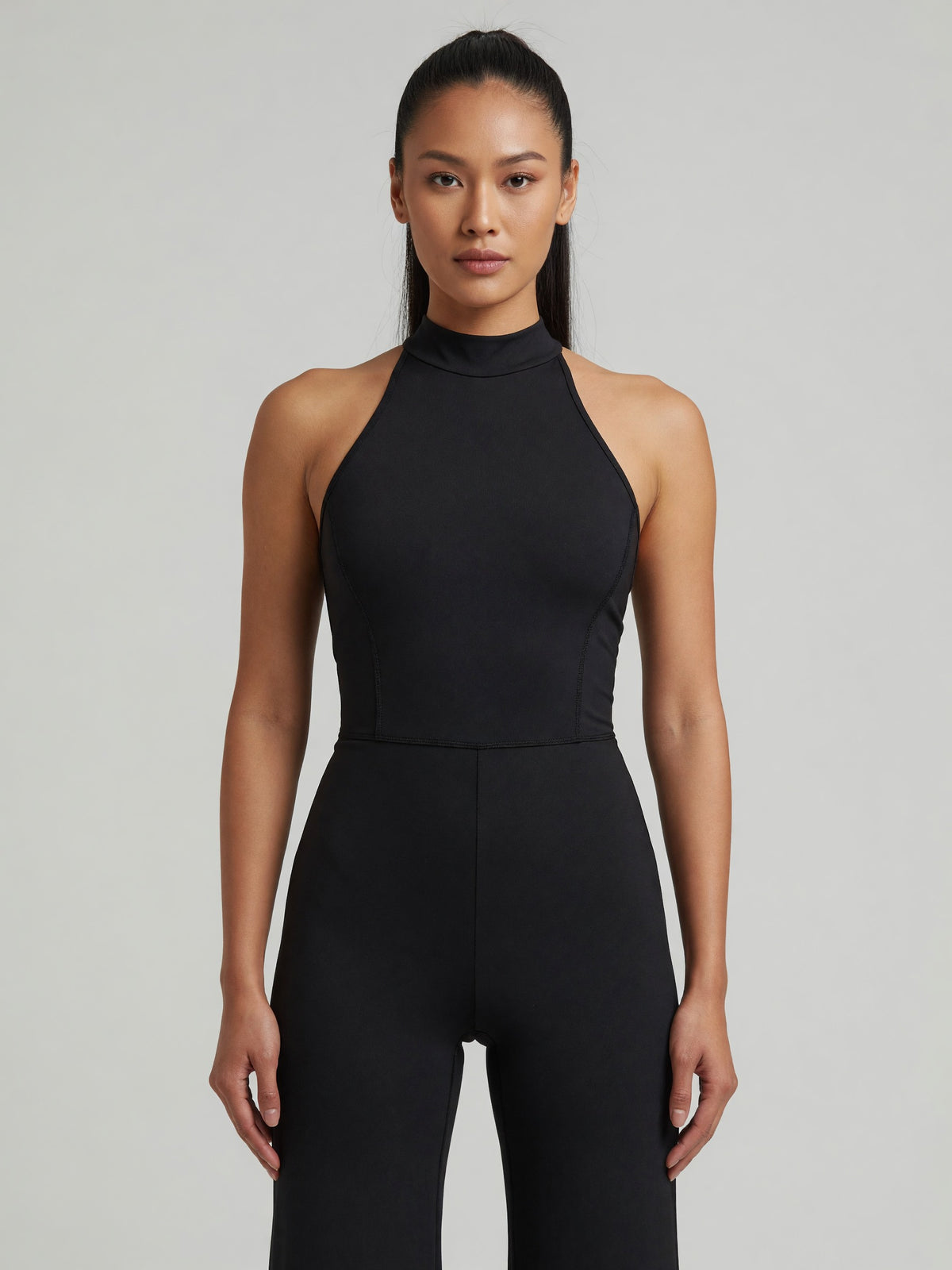 Halter Flare Jumpsuit in Black, worn, front