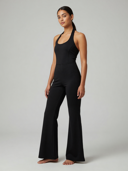 Halter Flare Jumpsuit in Black, worn, three-quarter