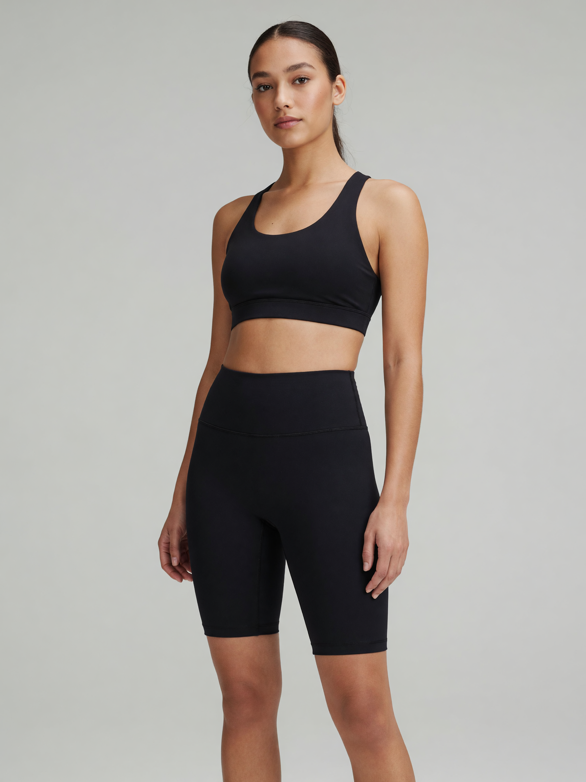 High-Rise Bike Short in Black, worn, three-quarter