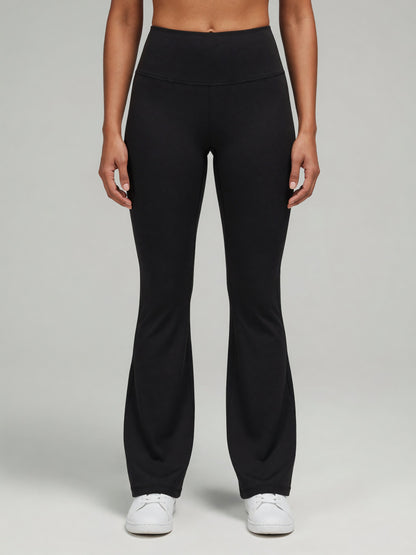 High-Rise Flare Legging in Black, worn, front