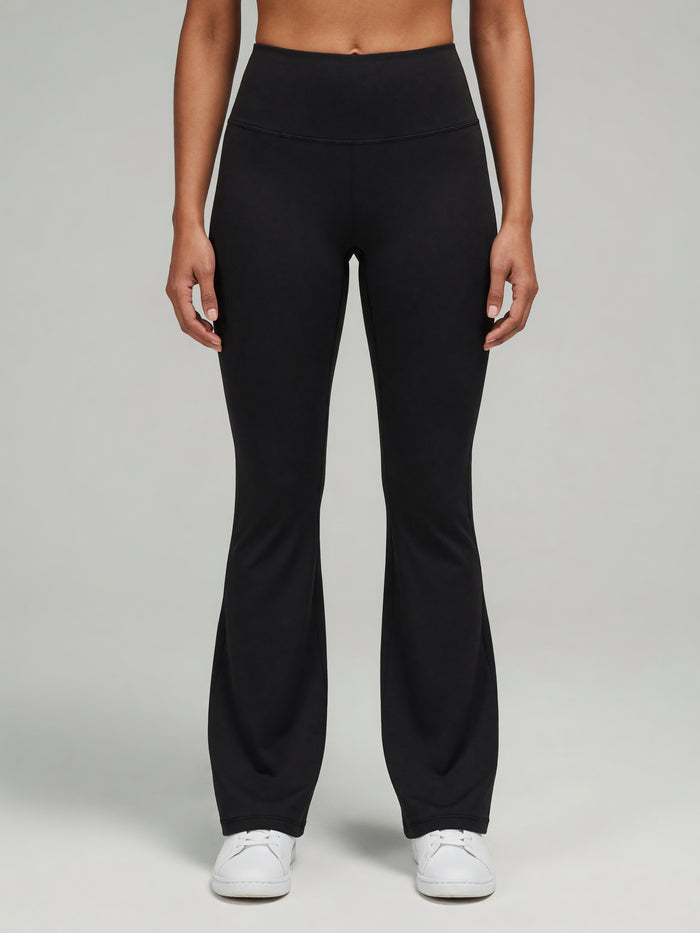 High-Rise Flare Legging in Black, worn, front
