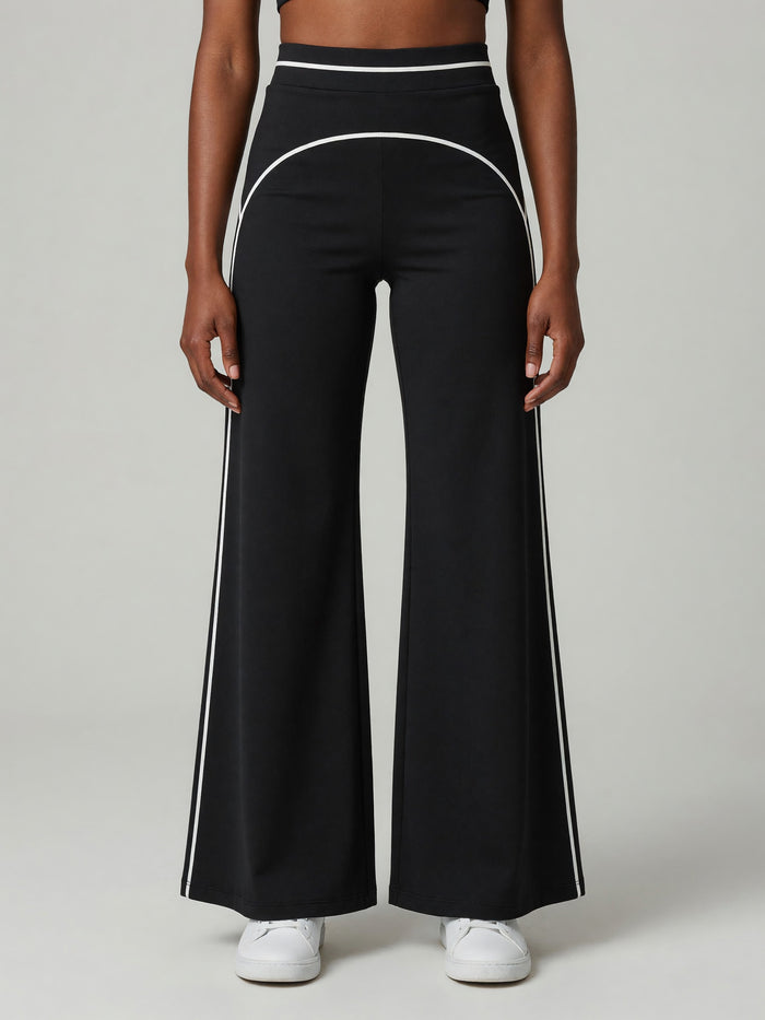 High-Rise Flare Pant in Black, worn, front