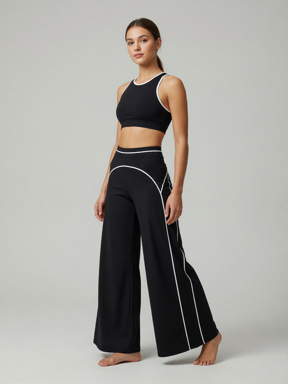 High-Rise Flare Pant in Black, worn, three-quarter