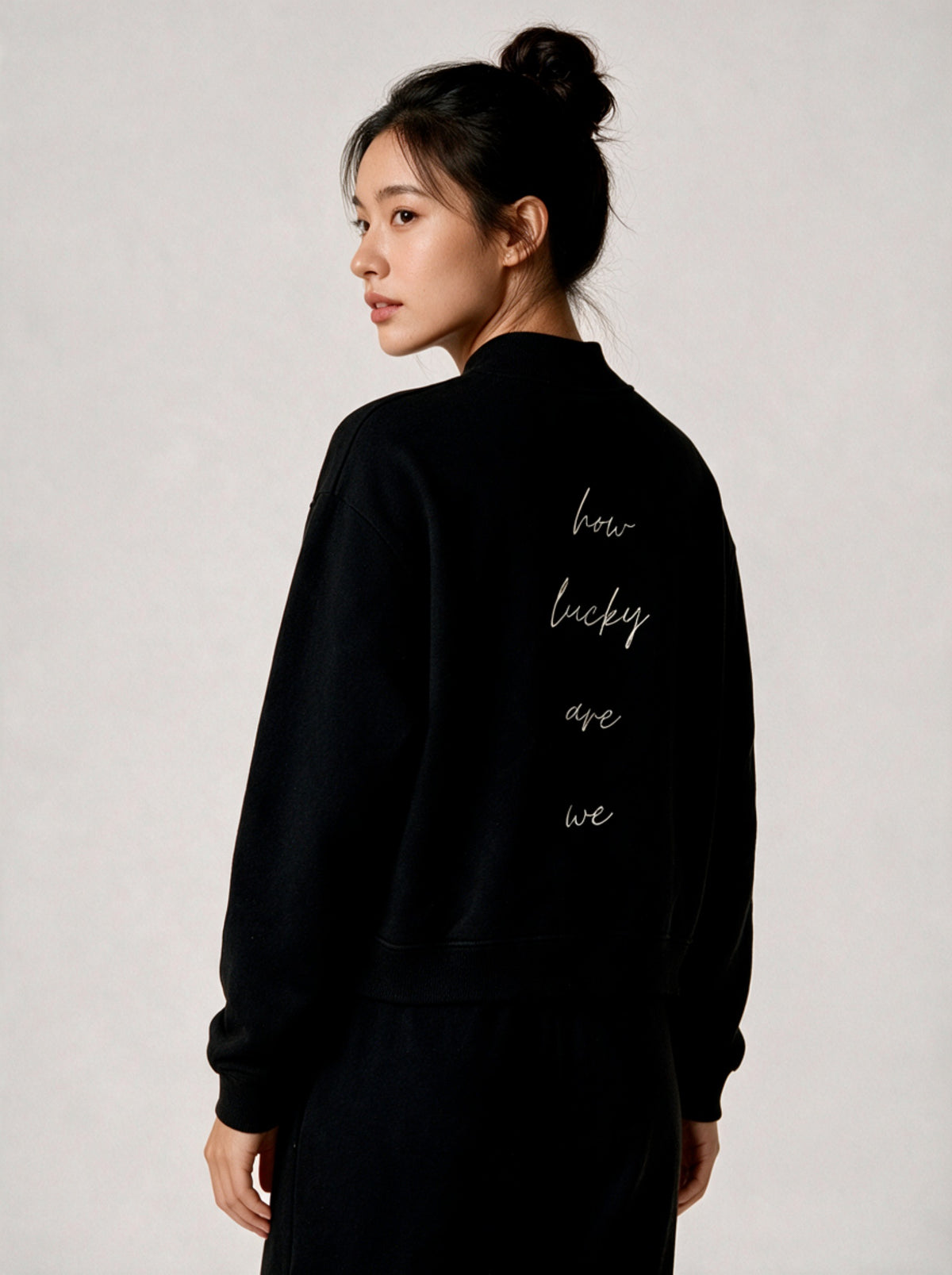 How Lucky Are We Mock-Neck Sweatshirt in Black, worn, back, second model