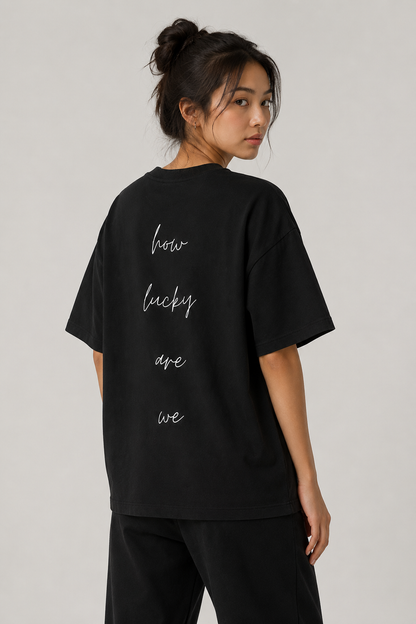 How Lucky Are We Tee in Black, worn, back