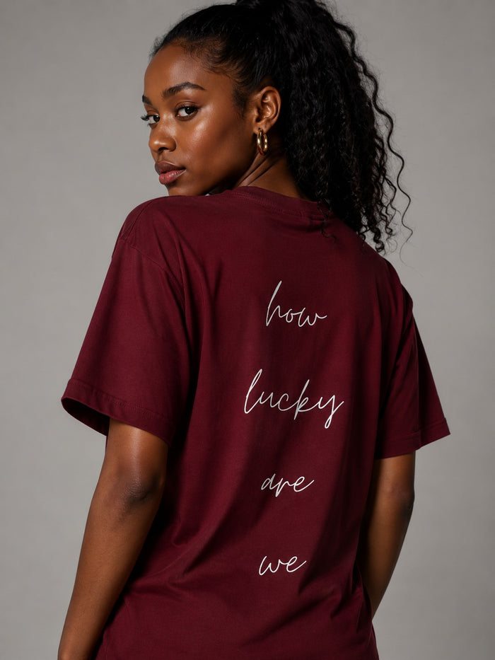 How Lucky Are We Tee in Wine Red, worn, back