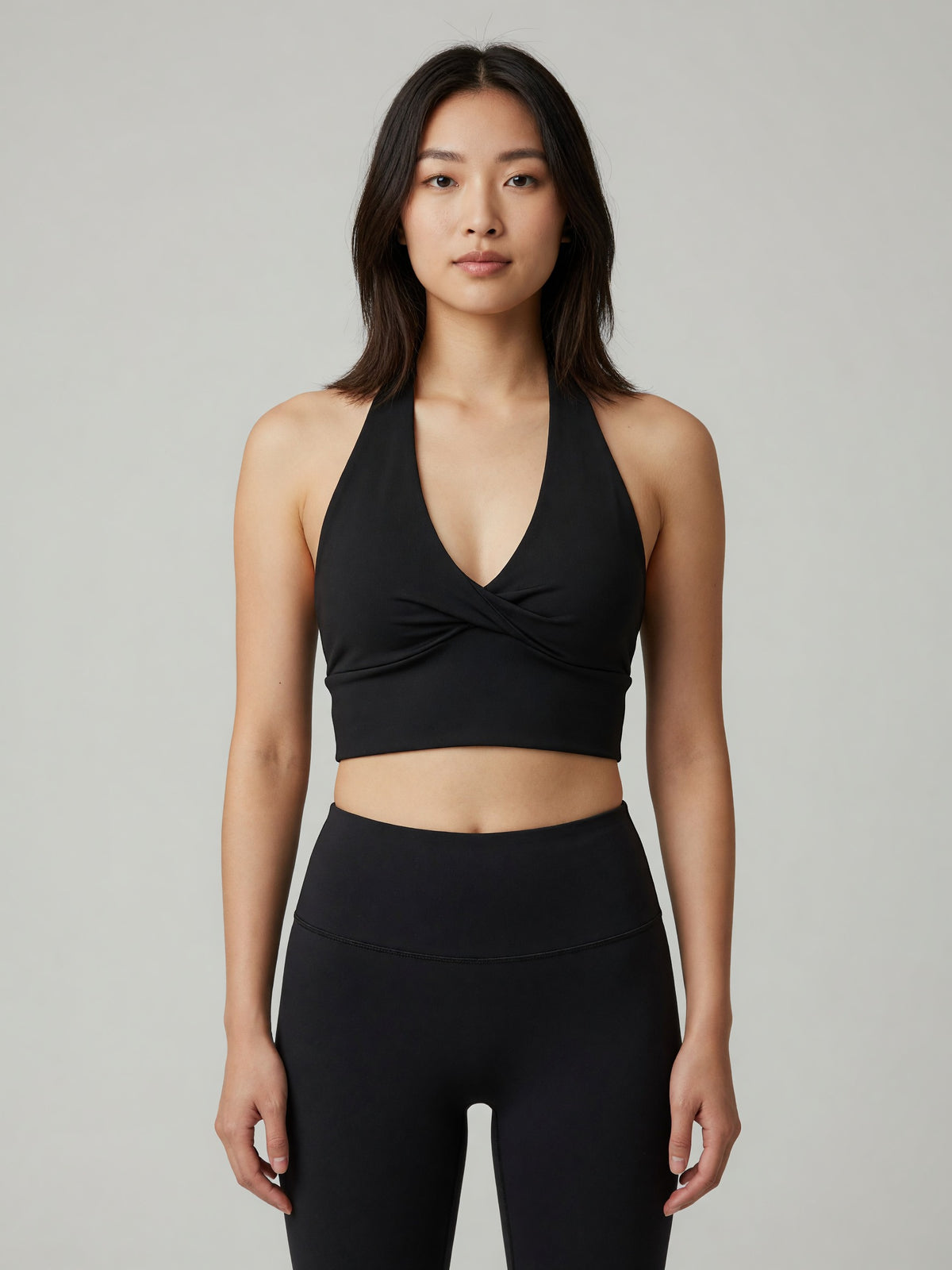 Pleated Halter Sports Bra in Black, worn, front