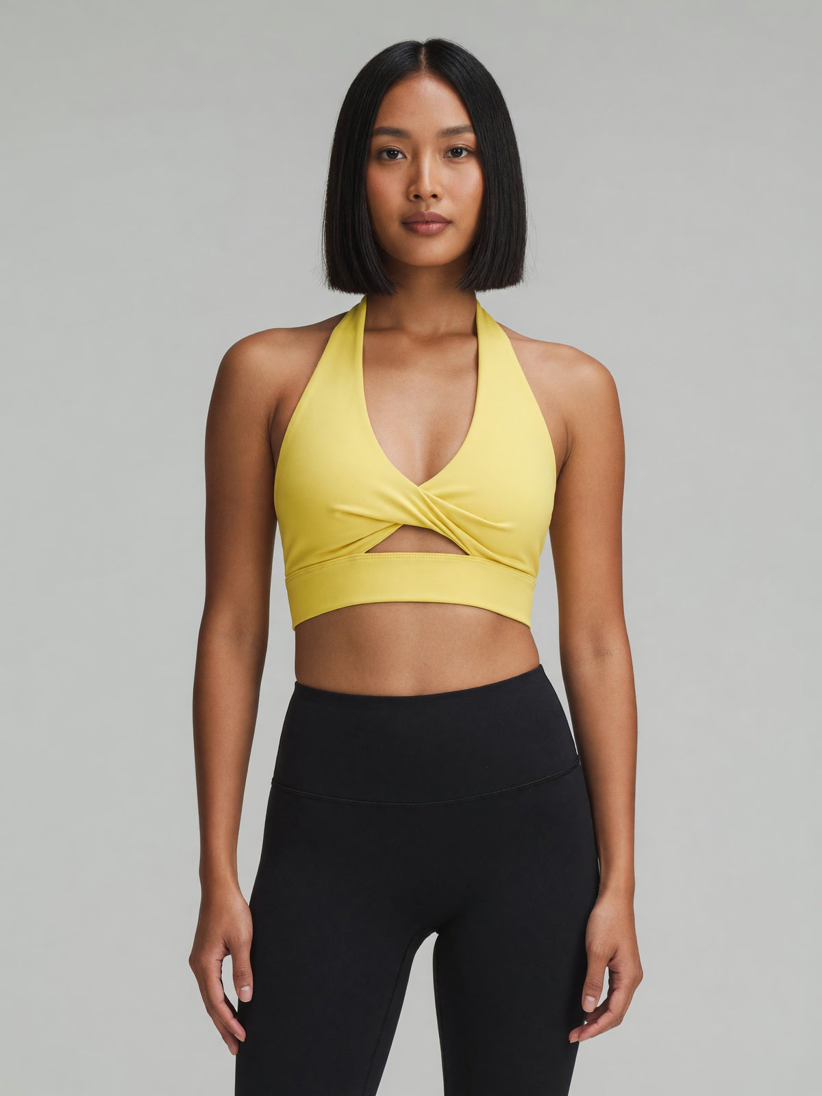 Pleated Halter Sports Bra in Yellow, worn, front