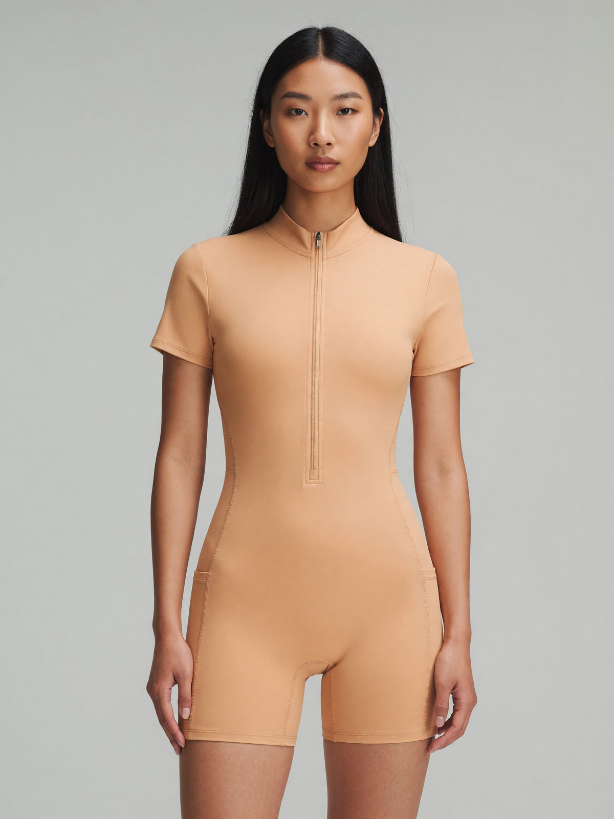 Quarter-Zip Sleeve Romper in Apricot, worn, front