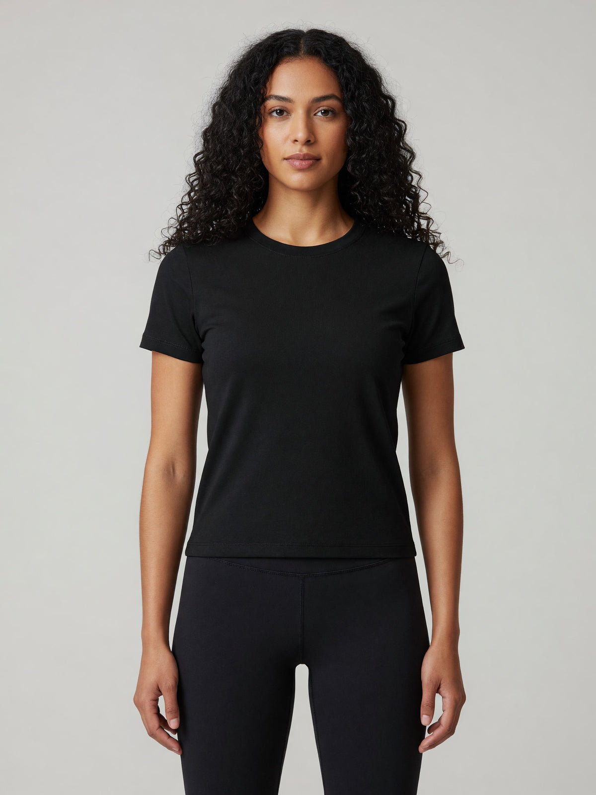 Slim Crewneck Tee in Black, worn, front