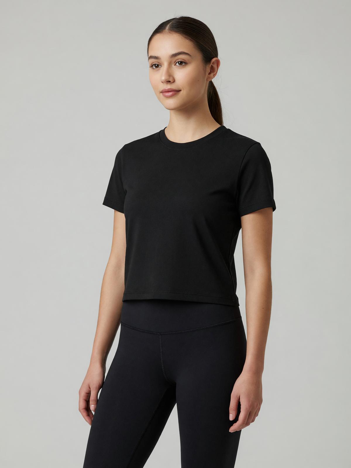 Slim Crewneck Tee in Black, worn, three-quarter