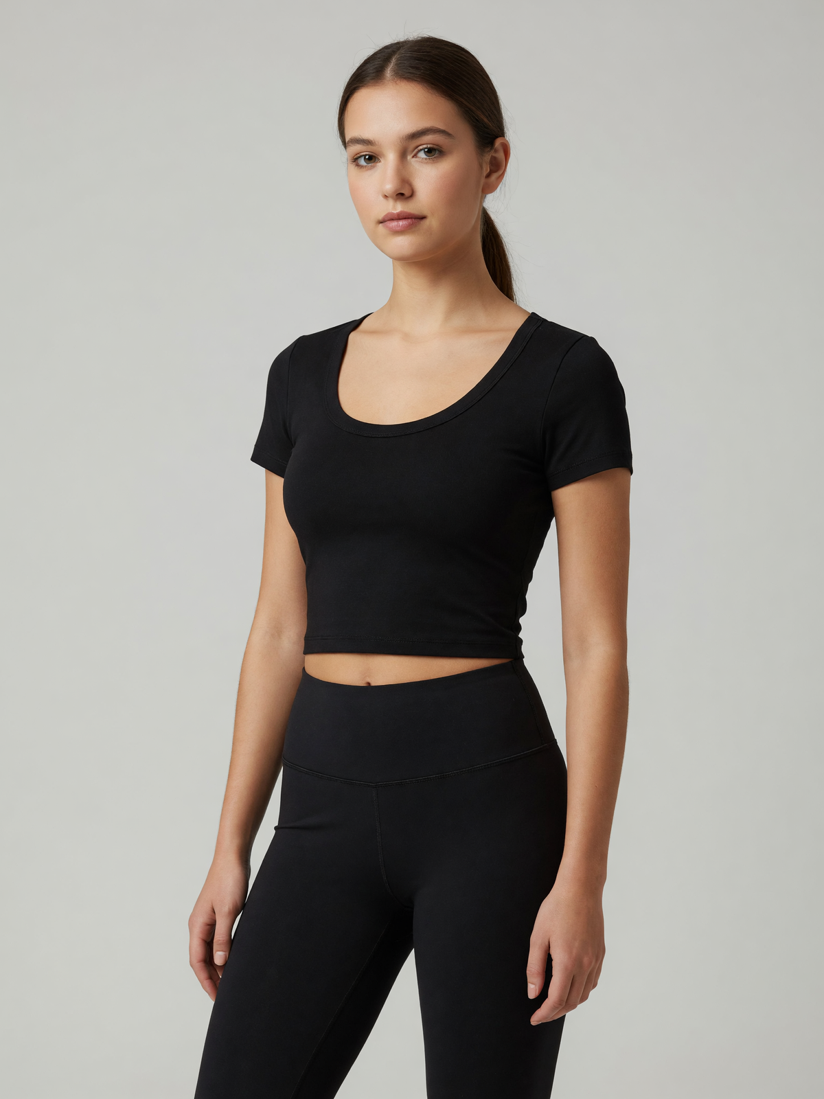 Slim Crop Tee in Black, worn, three-quarter