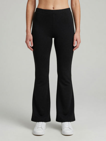 Slim Flare Sweatpant in Black, worn, front