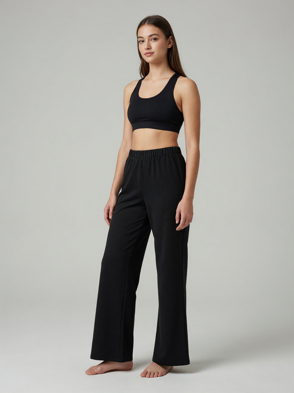 Slim Flare Sweatpant in Black, worn, three-quarter